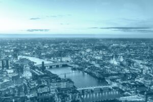 A panoramic shot of London from above showing the river Thames