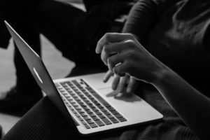 Hands typing on a keyboard