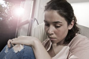 Young downcast woman