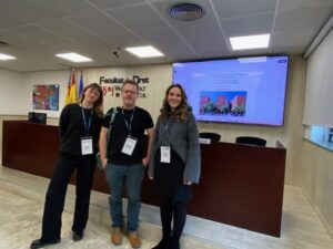 Mike Skidmore and two female colleagues at a conference 